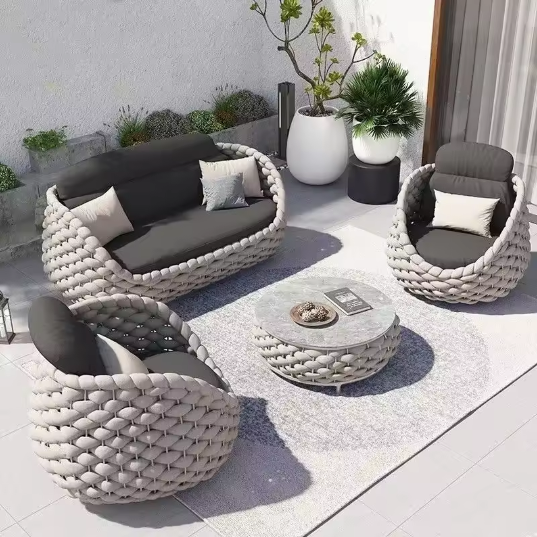 Marbella Rope Woven Rattan Garden 4-Piece Lounge Set in a garden