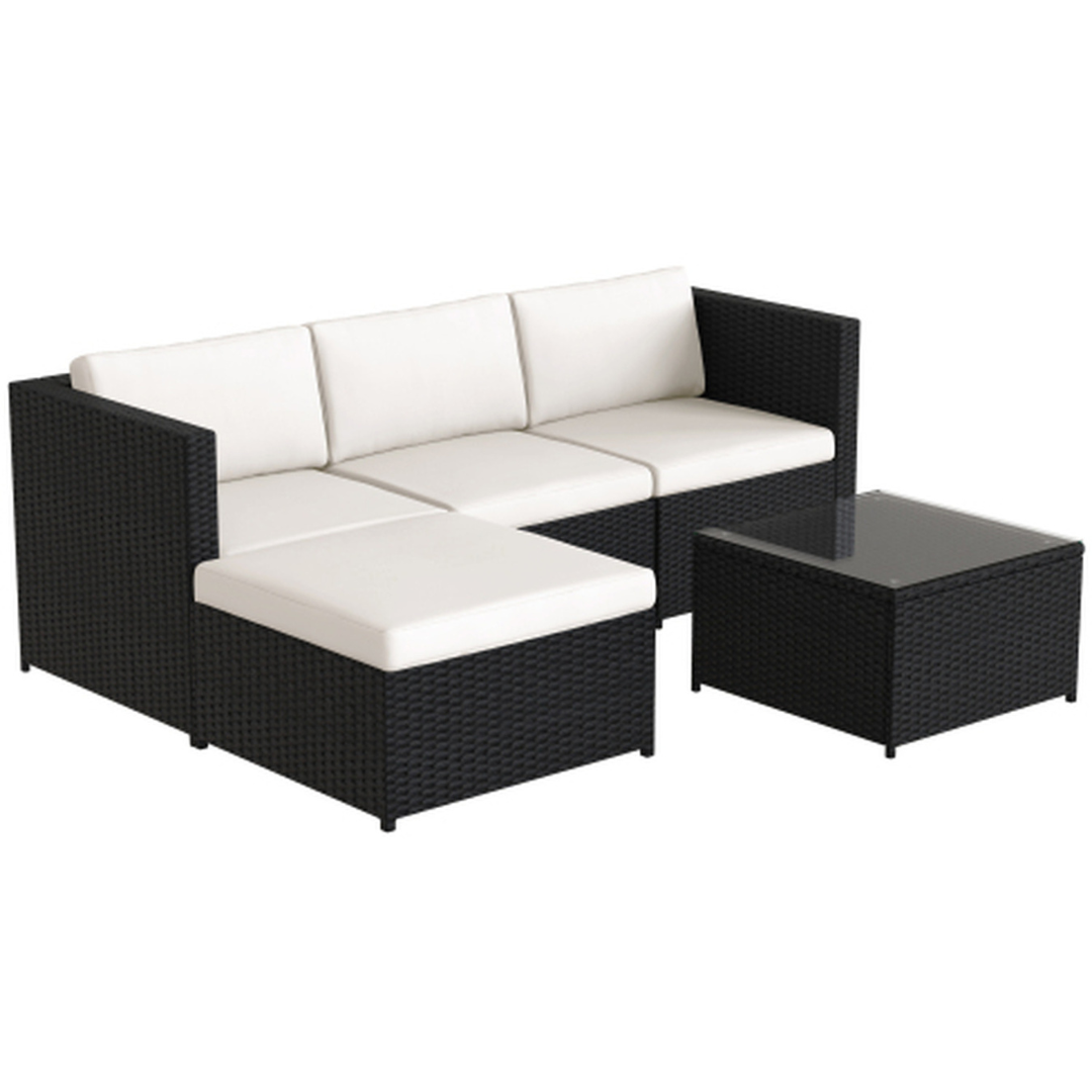 Black rattan corner sofa with cushions, white background