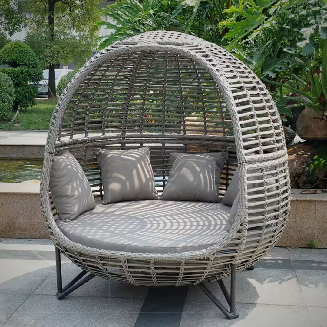 Modern rattan daybed for poolside or terrace relaxation