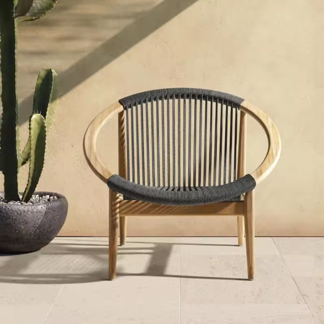 Black Contemporary Teak Garden Lounge Chair on an outdoor balcony