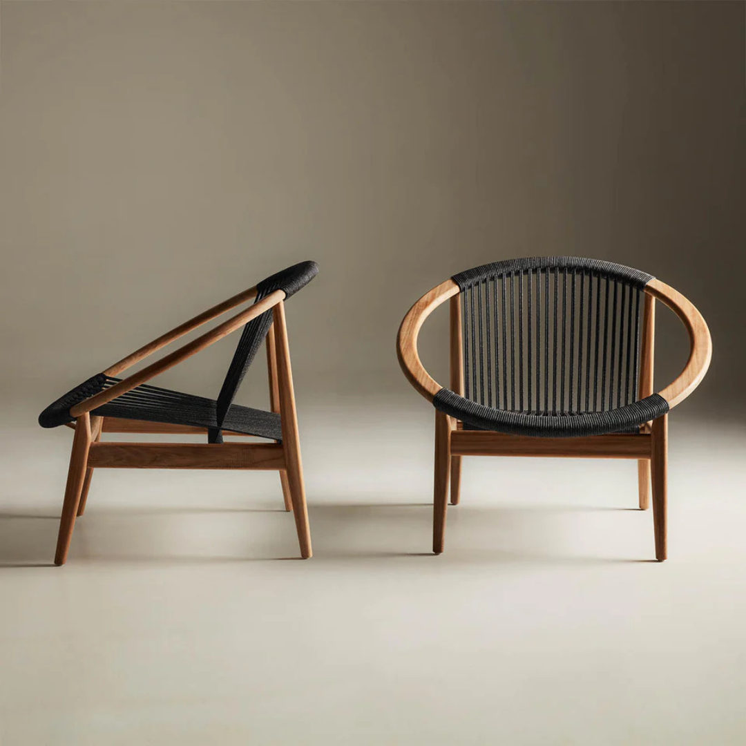 Black Contemporary Teak Garden Lounge Chair in a studio background