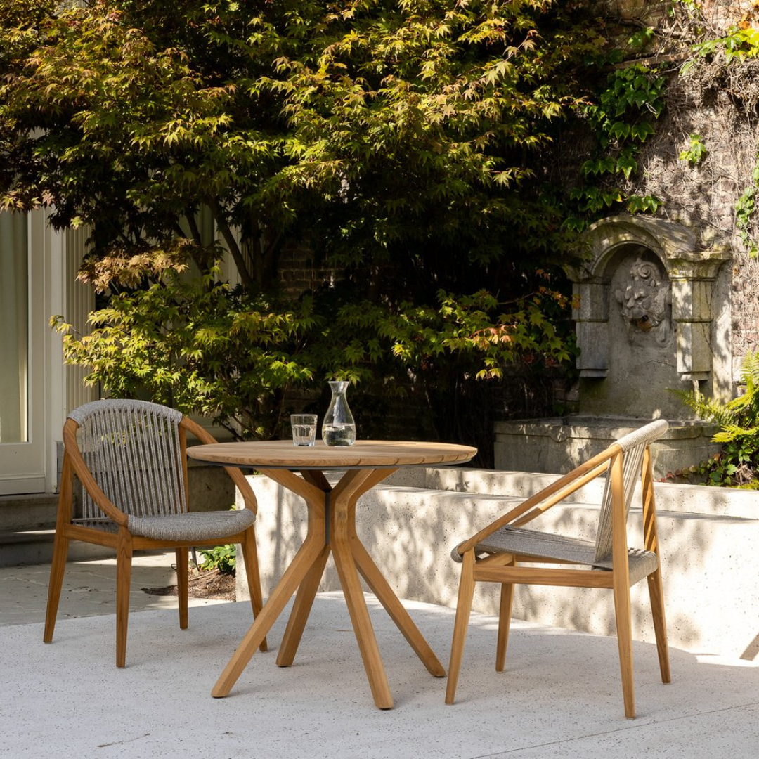 "Outdoor dining chair with natural teak texture"