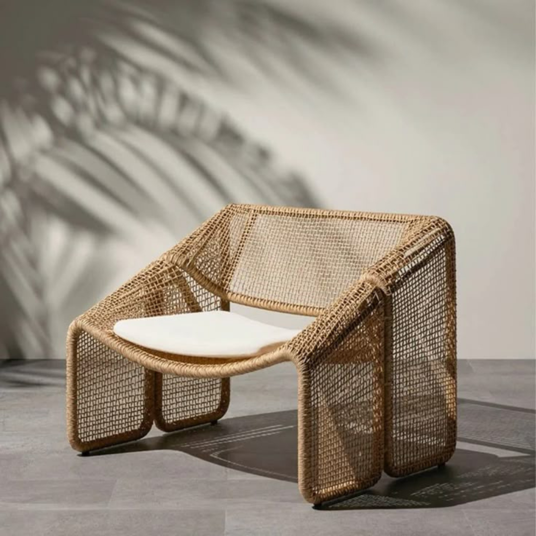 Relaxed style wicker sofas for garden lounge, single sofa, in a studio background
