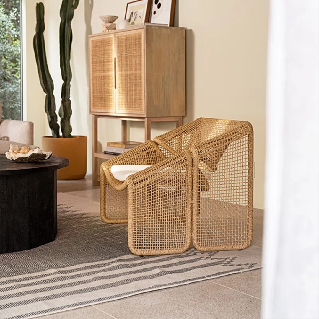 Relaxed style wicker sofas for garden lounge, side view of single sofa