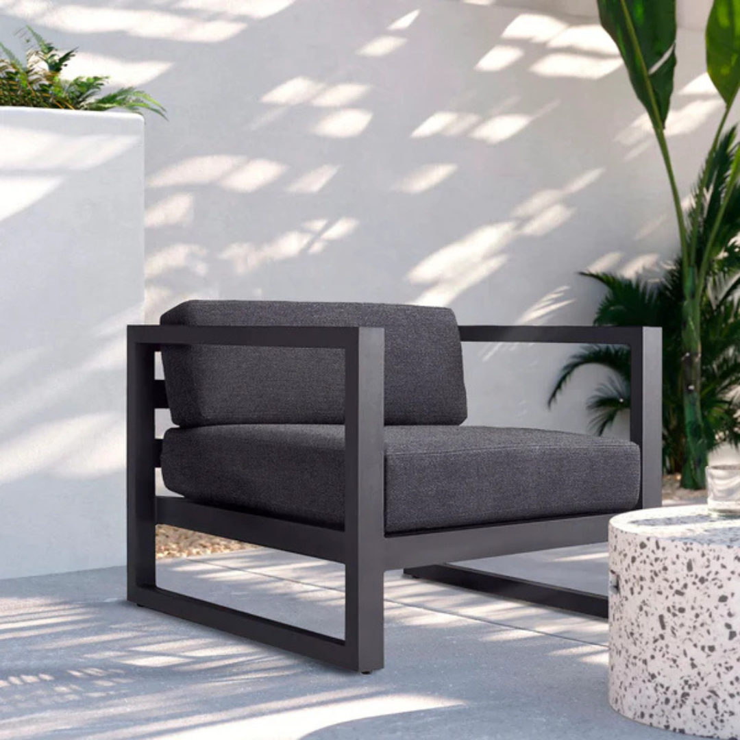 Modern aluminium garden armchair for stylish seating, right-angled view, in a modern stylish background