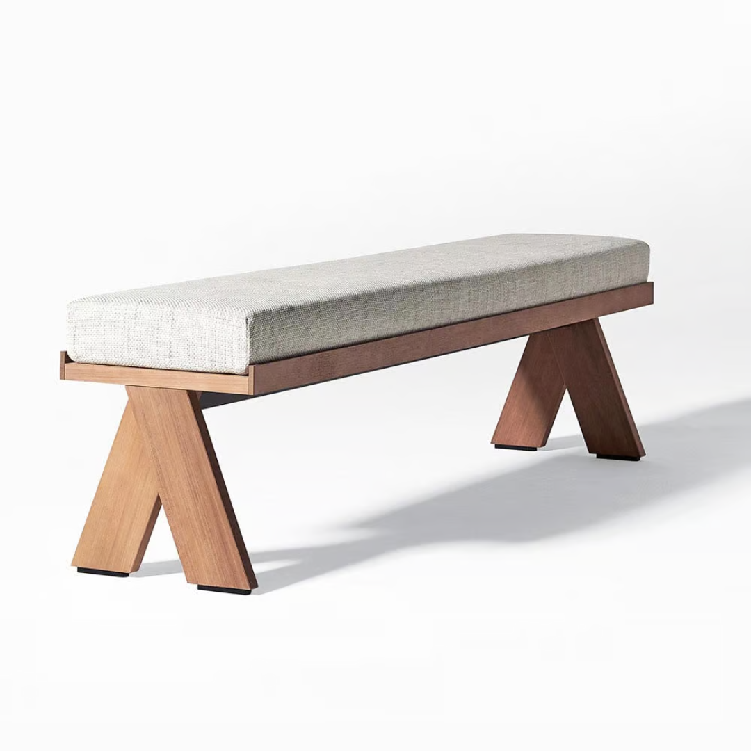 Contemporary outdoor dining table with matching benches, angled view of bench, white background