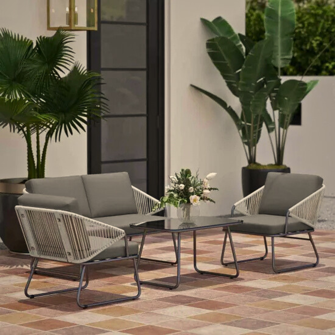 Outdoor lounge set with rope armchairs and sofa, on a outdoor patio