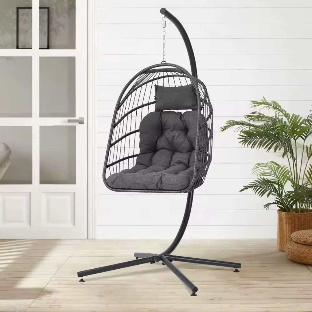 single outdoor hanging egg chair with stand and cushion, in a outdoor balcony