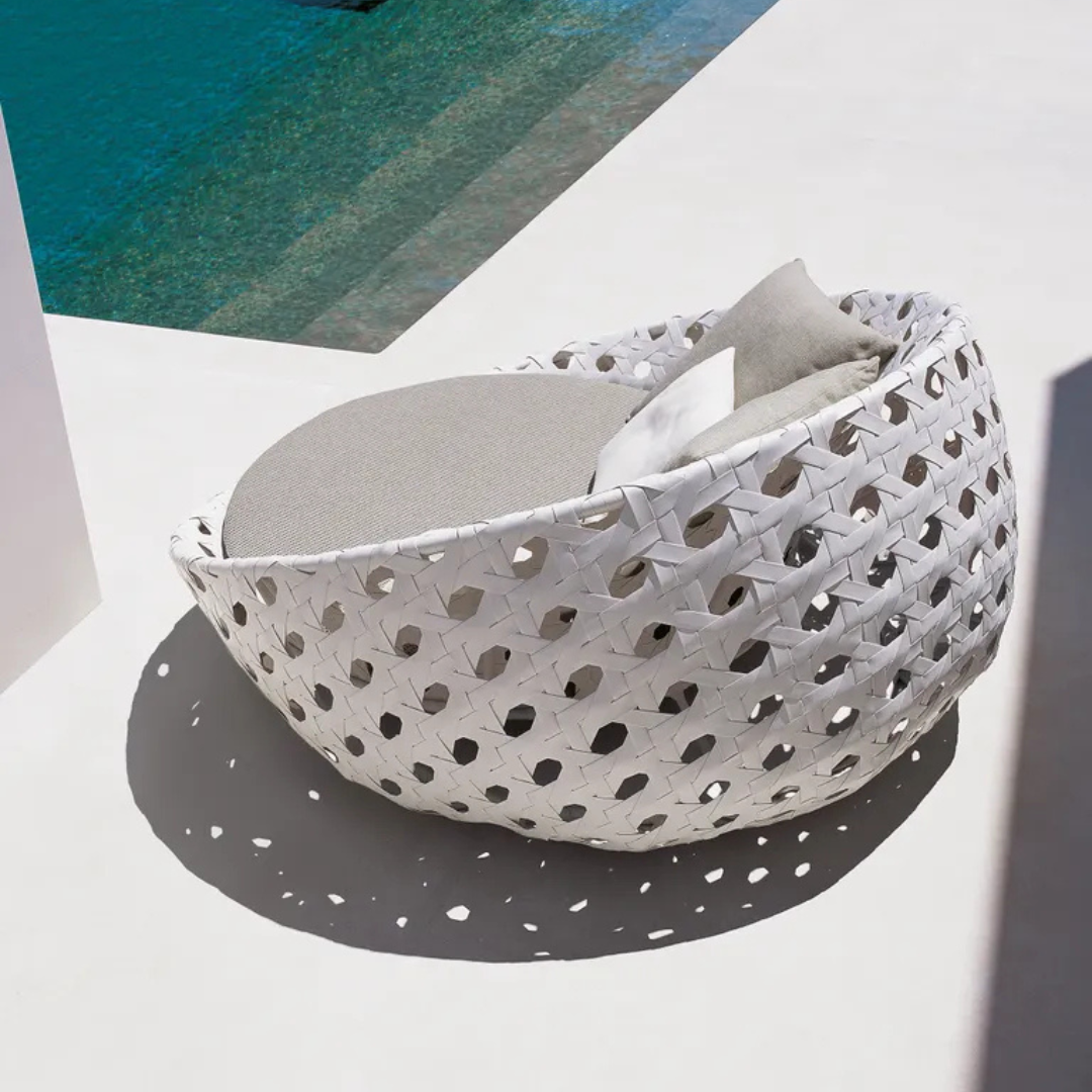 Modern white woven round daybed for stylish patio lounging, birds eye view