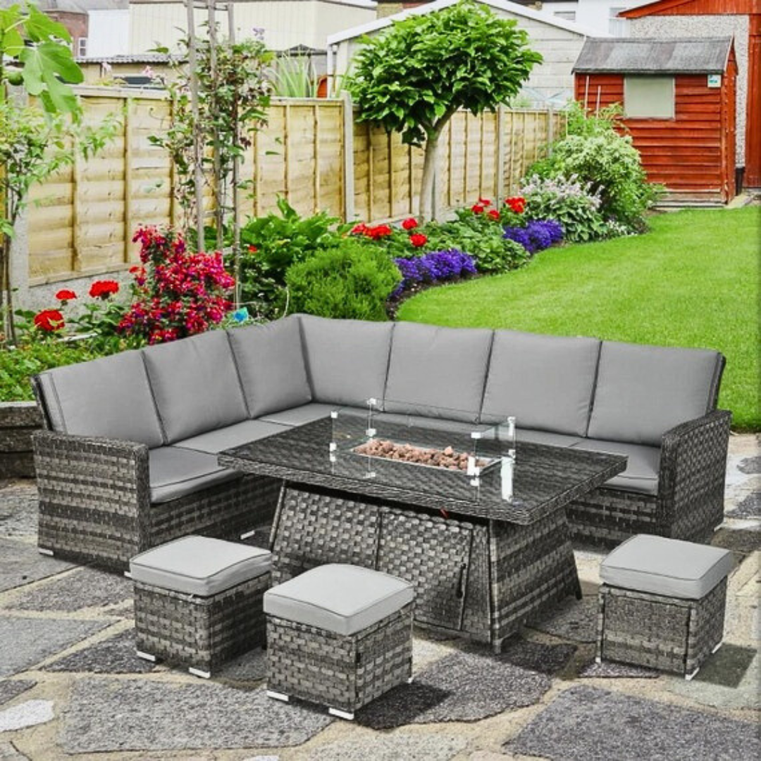 7 piece rattan fire pit garden furniture set, with a garden background.
