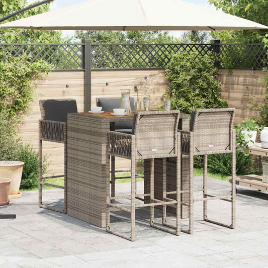 Acacia rattan outdoor bar table with matching chairs, in a garden setting
