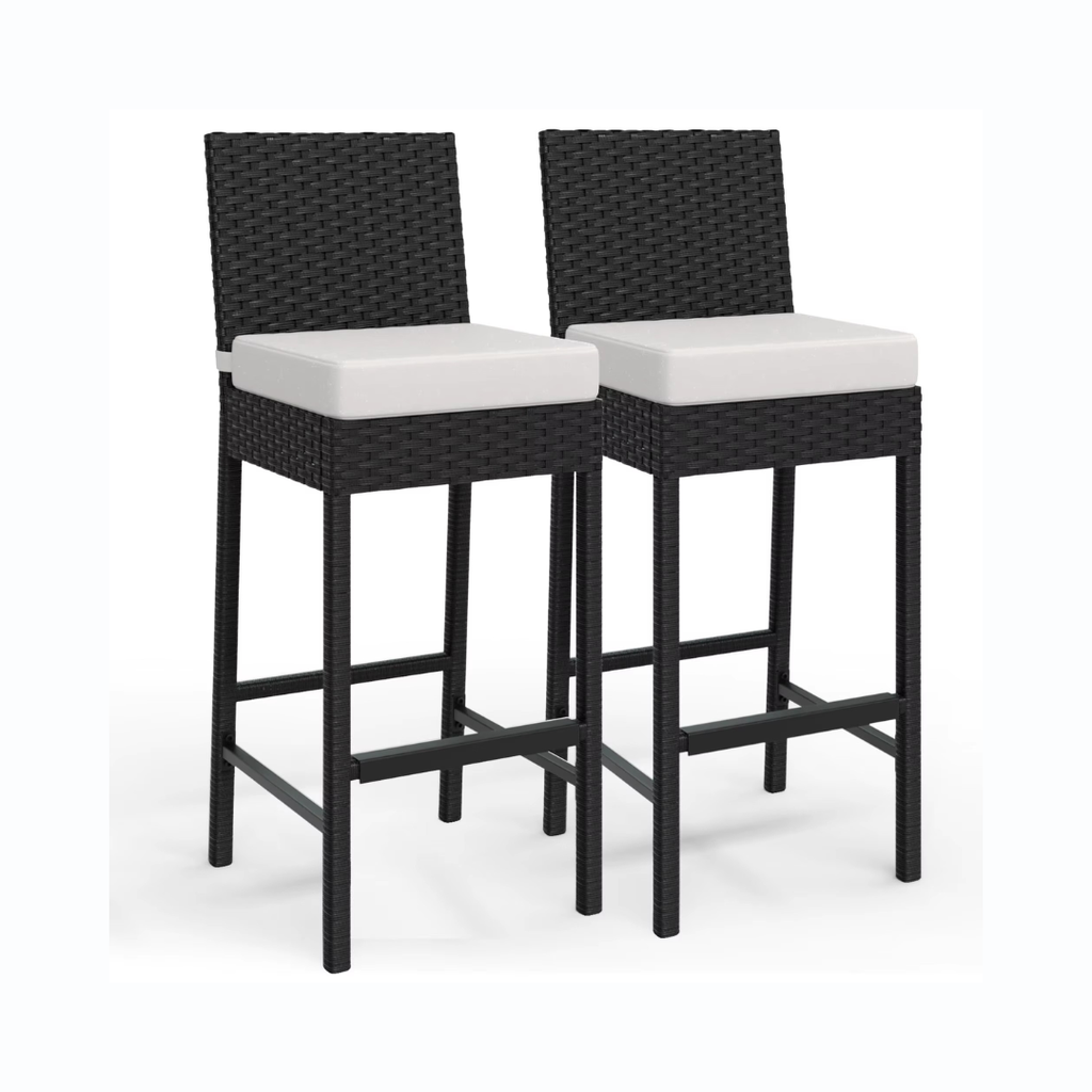 Two black wicker bar stools with white cushions on a white background