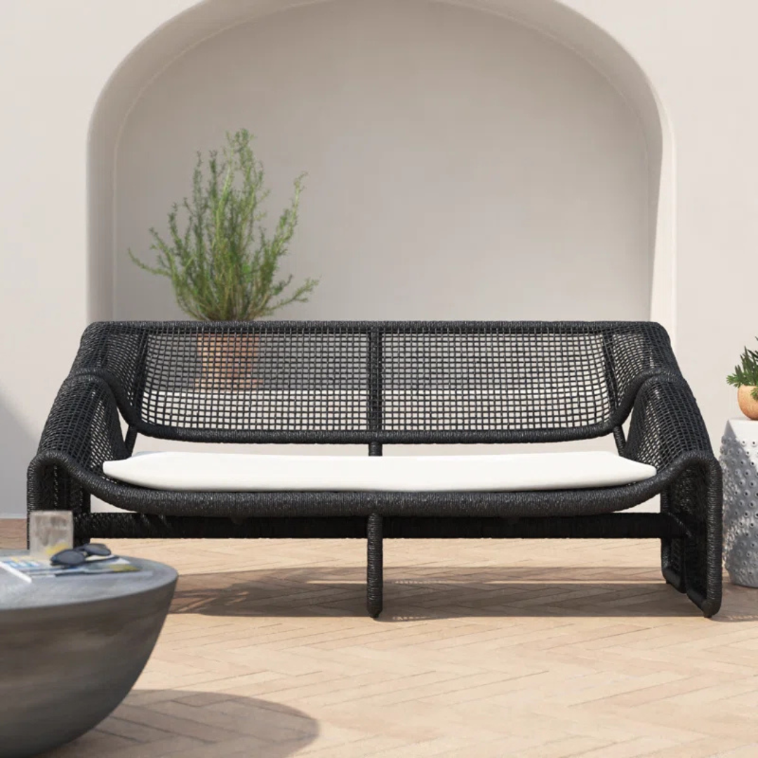 Black Reclined Wicker Garden Sofa, in a luxury outdoor setting