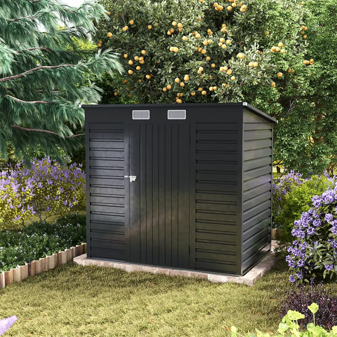 Black garden storage shed with modern finish, on a stone patio with a garden background