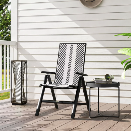 Black outdoor chair with patterned backrest on a wooden deck