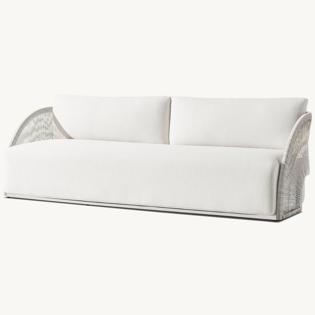 Modern rattan three-seater sofa for outdoor use, cream, angled view
