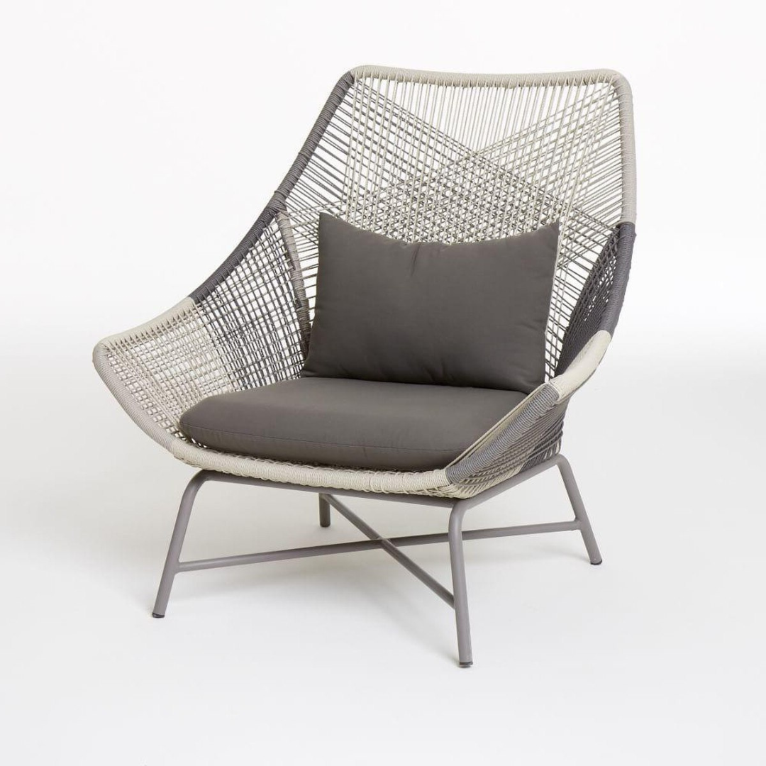 Contemporary rattan lounge set, lounge chair in a studio background