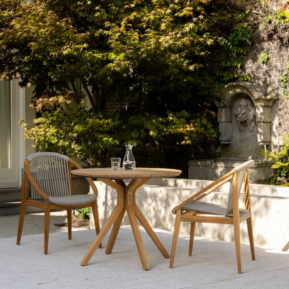 "Outdoor dining chair with natural teak texture"