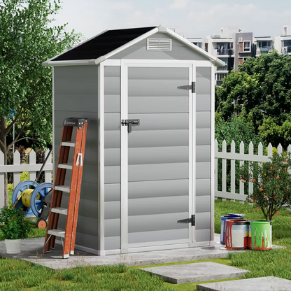Space-saving garden shed with modern grey finish, small shed in a garden background