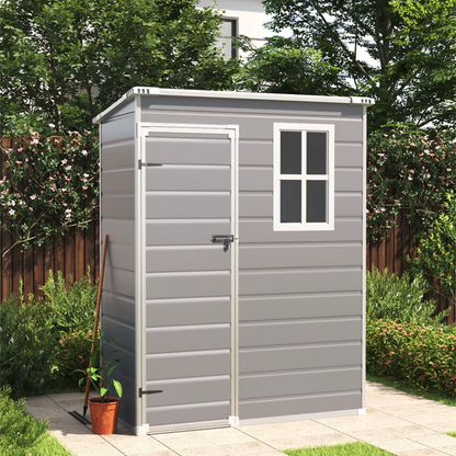 Space-saving garden shed with modern grey finish, left hand door, in a garden background