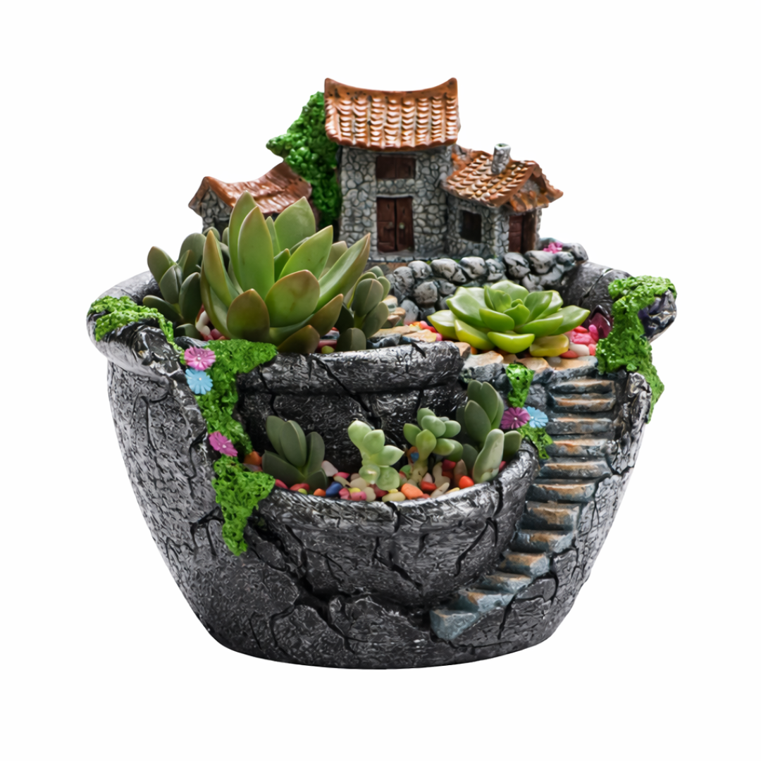 Decorative pot with miniature house and succulents on a white background