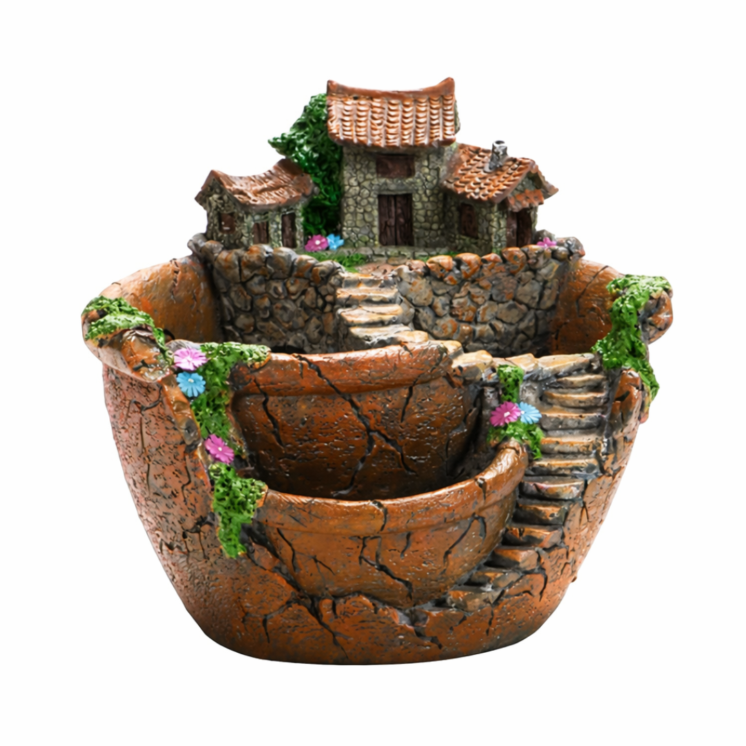Decorative miniature village inside a pot on a white background