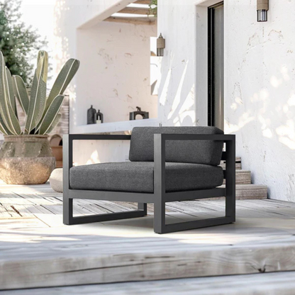 Modern aluminium garden armchair for stylish seating, angled view, in a stylish outdoor setting