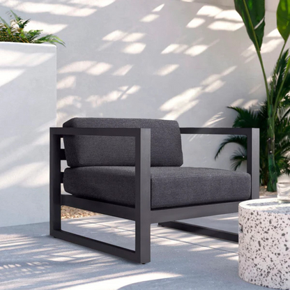 Modern aluminium garden armchair for stylish seating, right-angled view, in a modern stylish background