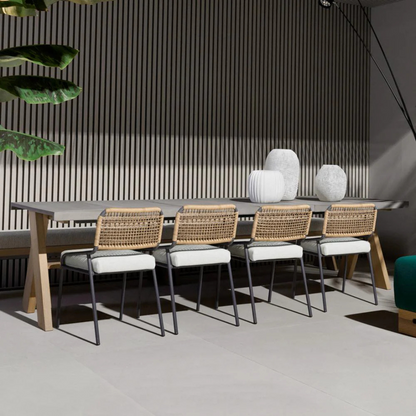 Contemporary outdoor dining table with matching benches, on a outdoor patio 