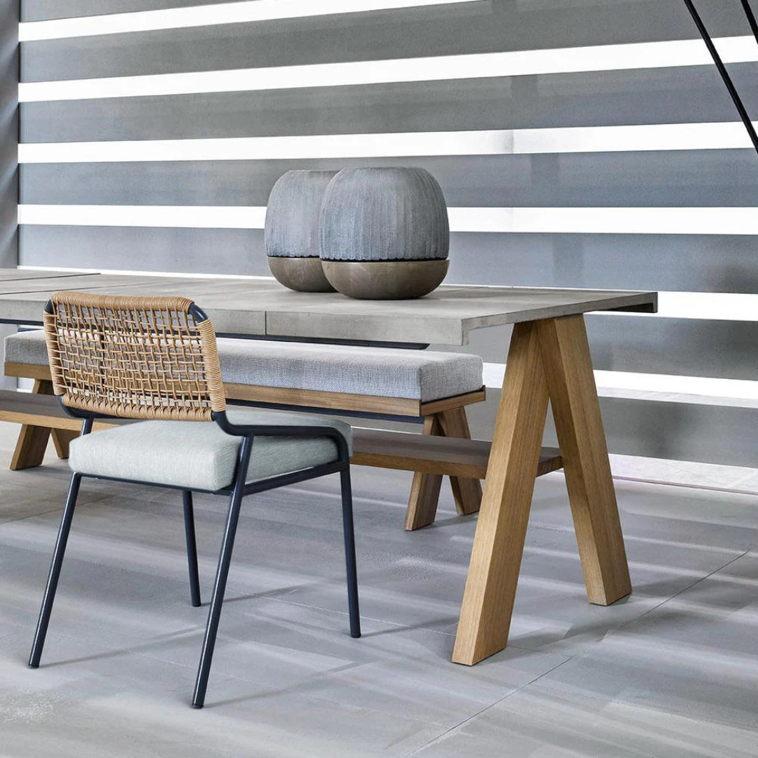 Contemporary outdoor dining table with matching benches, close up