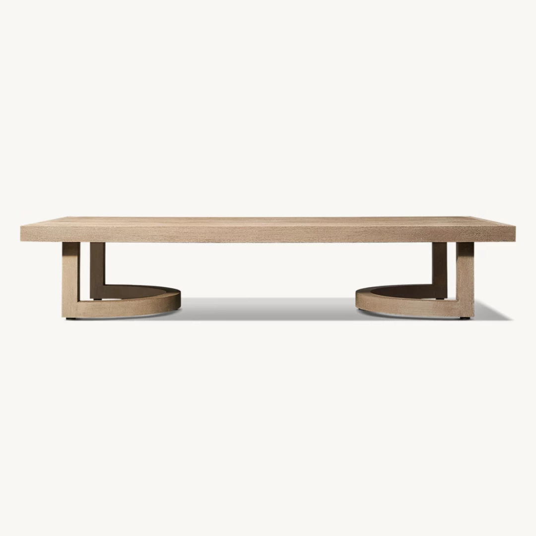 Low outdoor coffee table with natural wood finish, side view, studio background.