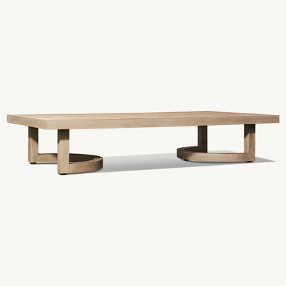 Low outdoor coffee table with natural wood finish, angled view, studio background