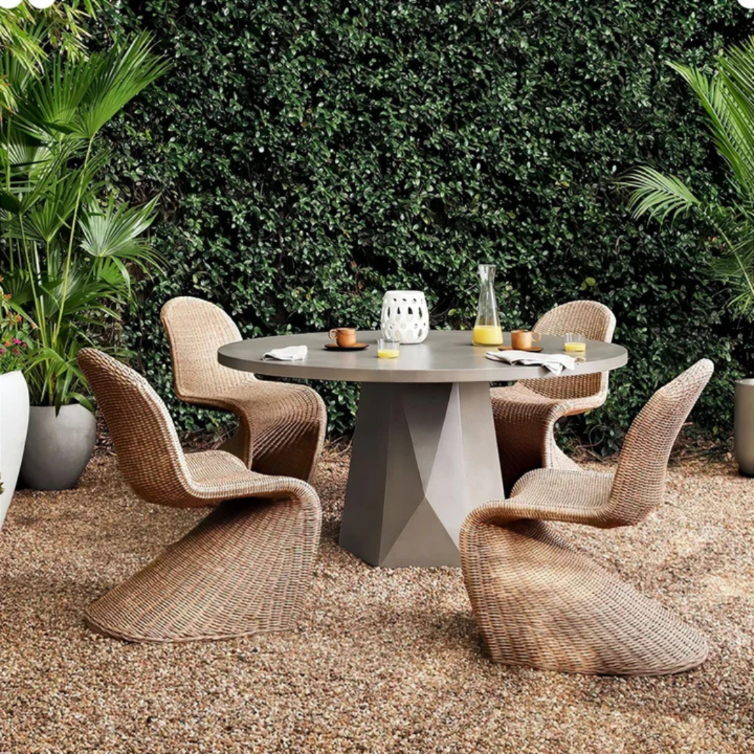 Curved Accent Rattan Outdoor Dining Chairs with stylish design, in a garden background