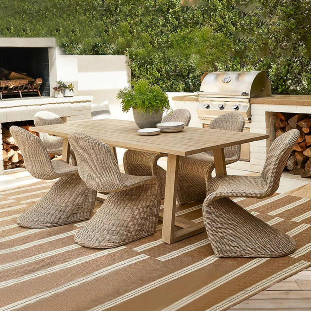 Curved Accent Rattan Outdoor Dining Chairs with stylish design, cream chairs in a garden background