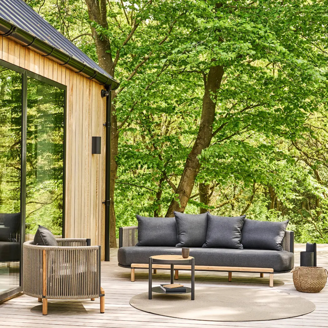 Outdoor rope furniture set with cushioned seating, photo shows the complete set in a luxury outdoor setting.
