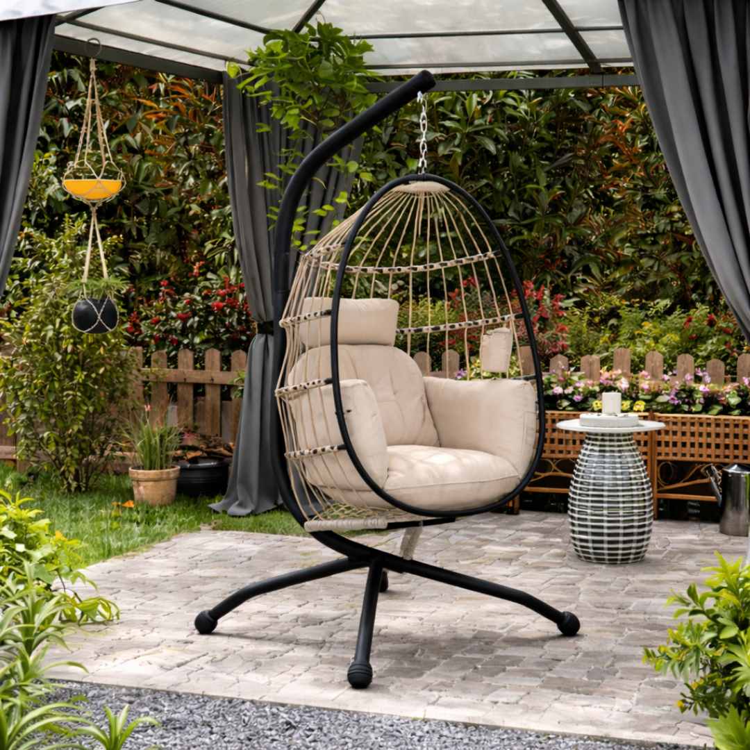 Outdoor egg hanging chair with stand, set in a tradition garden with greenery.