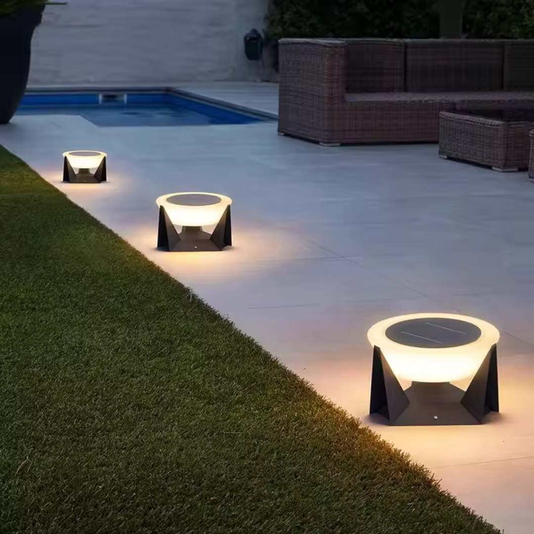 "Round LED solar lamps for outdoor garden lighting, lighting up an outdoor footpath.