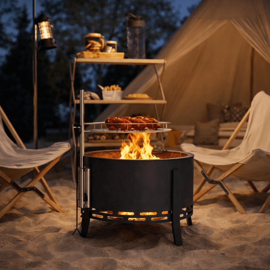 image shows a garden bbq firepit set around two camping chairs on a beach.
