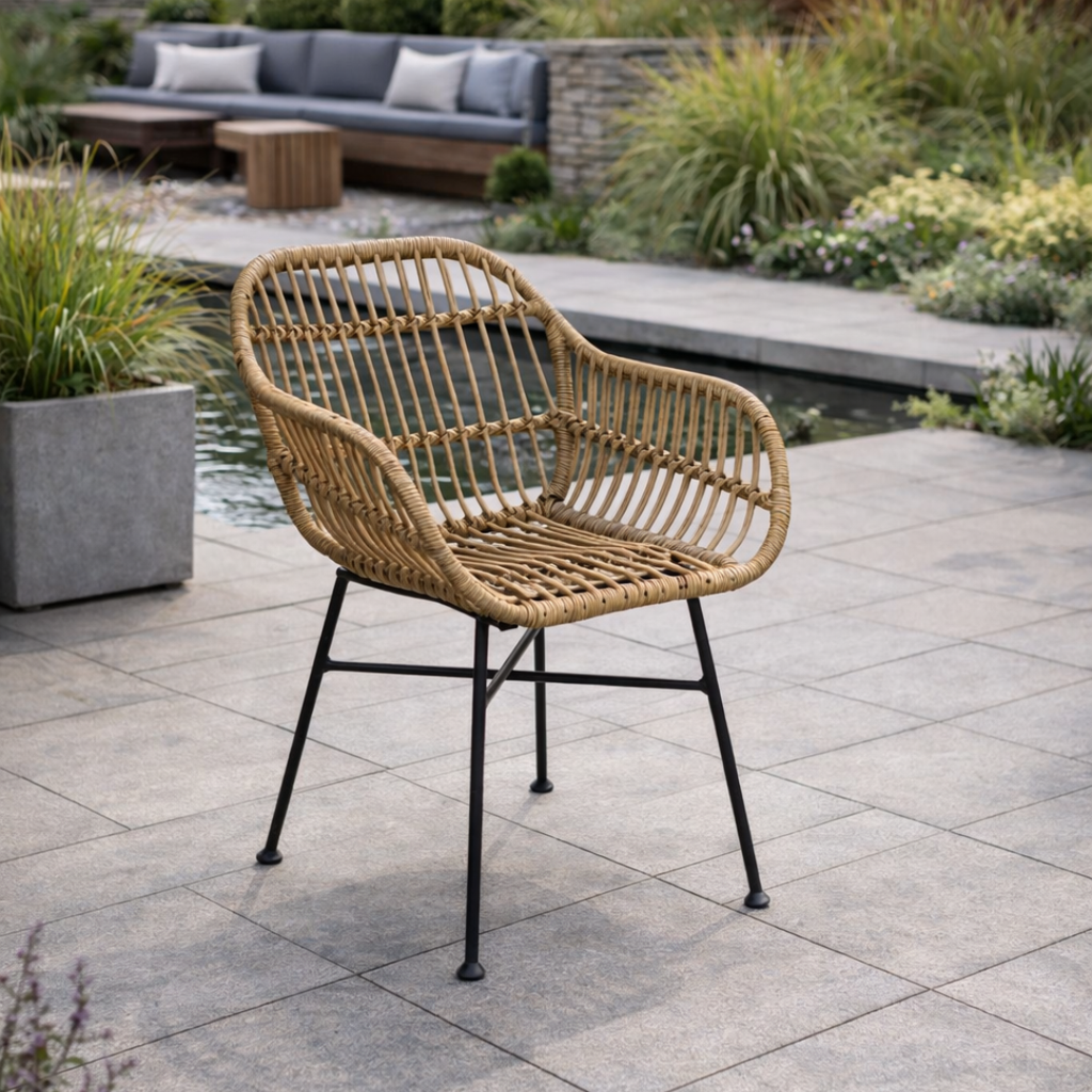 Wicker chair on a patio with garden and seating area in the background