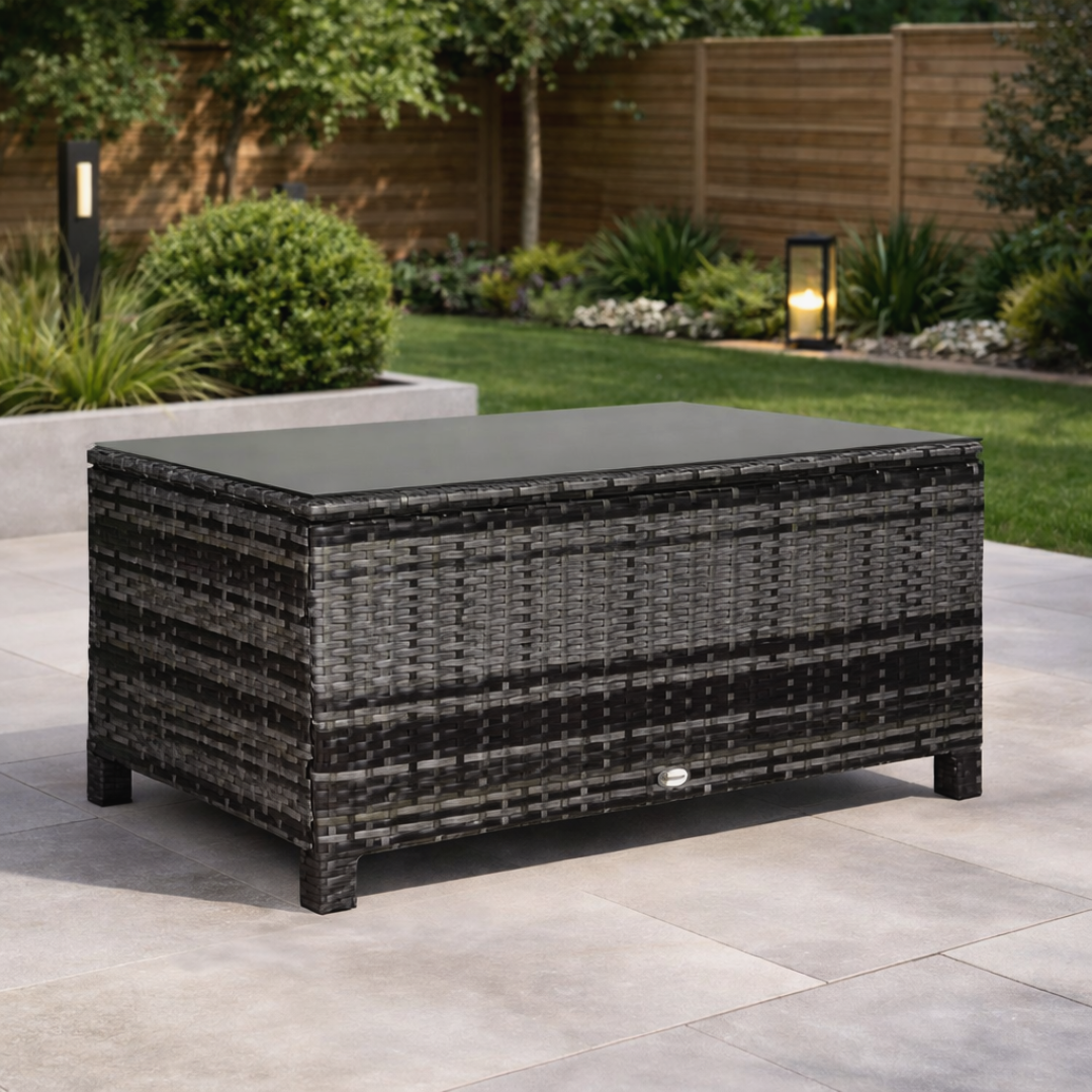 Outdoor patio table with wicker design on a patio area with garden background